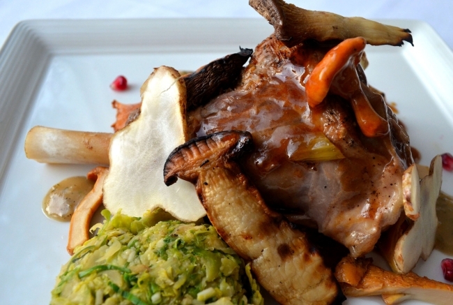 Guinness Braised Merino Lamb Shank, Brussels Sprouts Gratin, Chanterelle and Royal Trumpet Mushroom Salad, Sherry-Marjoram Vinaigrette