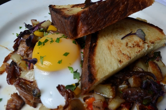 Duck Confit and Truffle Hash, Peppers and Onions, Sunnyside Duck Egg, Brioche Toast